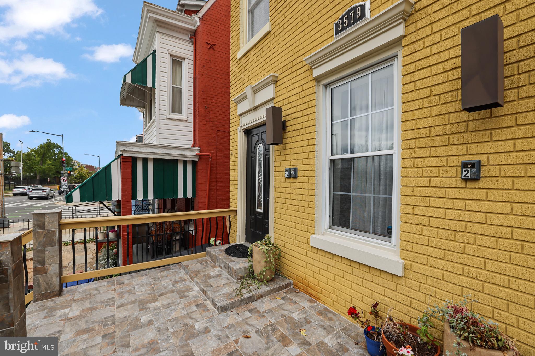 3579 Warder Street Northwest, Unit 3 Washington, DC 20010 - Photo 3 of 25 a view of a brick house with many windows