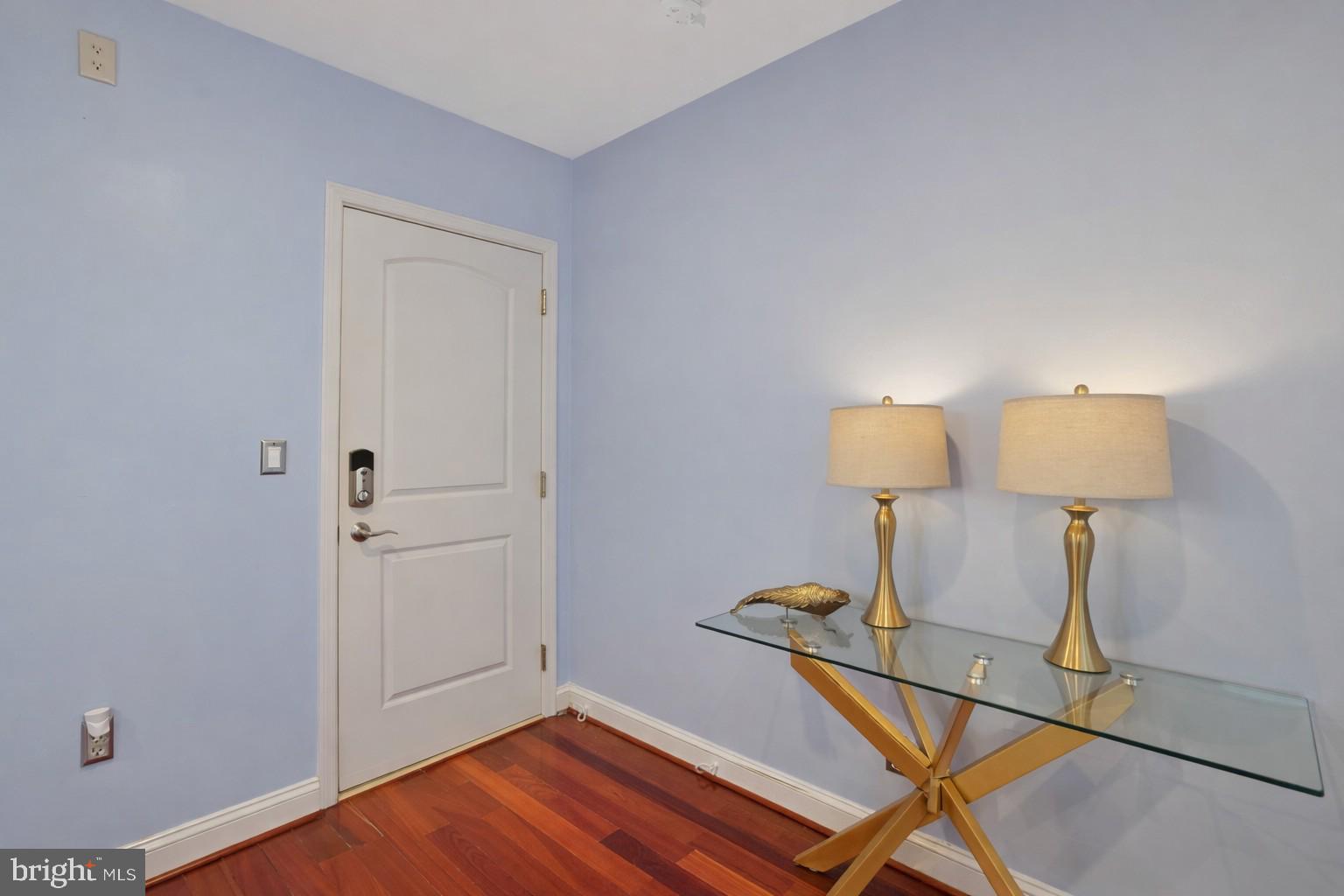 3579 Warder Street Northwest, Unit 3 Washington, DC 20010 - Photo 6 of 25 a room with wooden floor and lamp