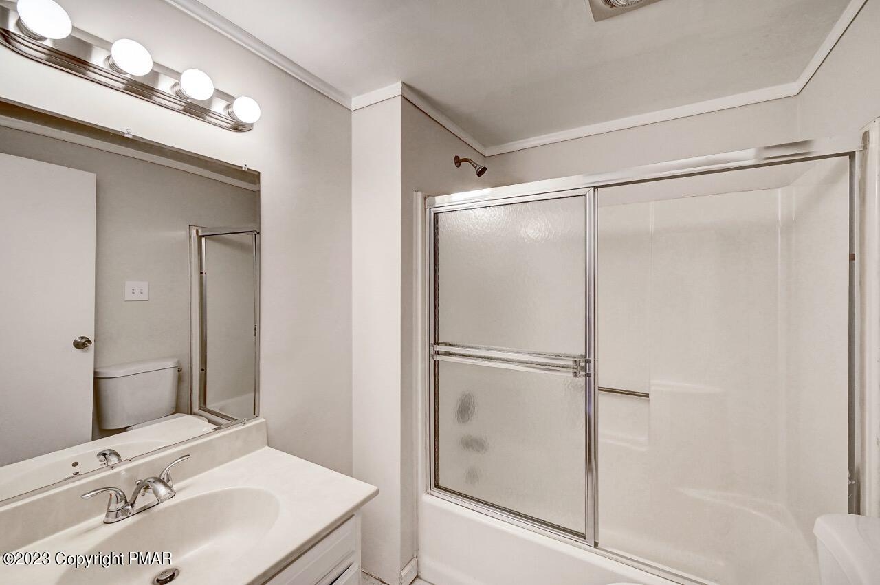 130 Estates Road Greentown, PA 18426 - Photo 25 of 34 a bathroom with a sink vanity and a mirror