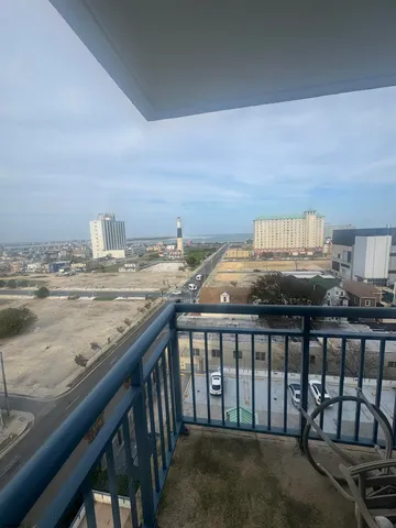 a view of kitchen with granite countertop window
