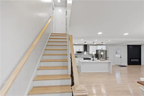 a view of kitchen with furniture and wooden floor