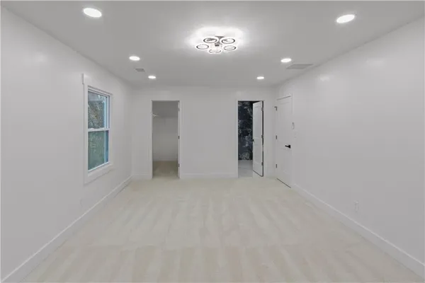 a white bath tub sitting next to a white toilet