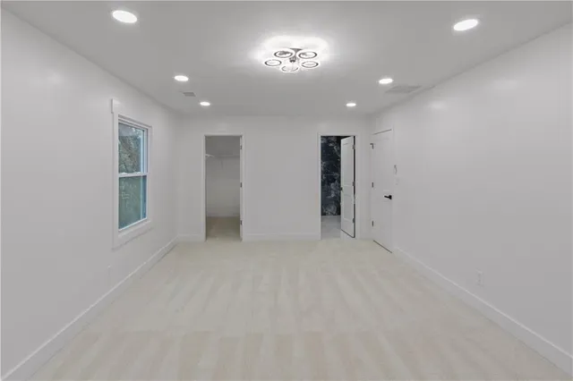 a white bath tub sitting next to a white toilet