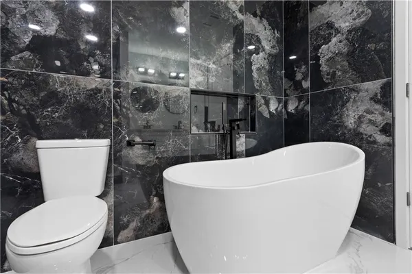 a bathroom with a sink mirror and vanity