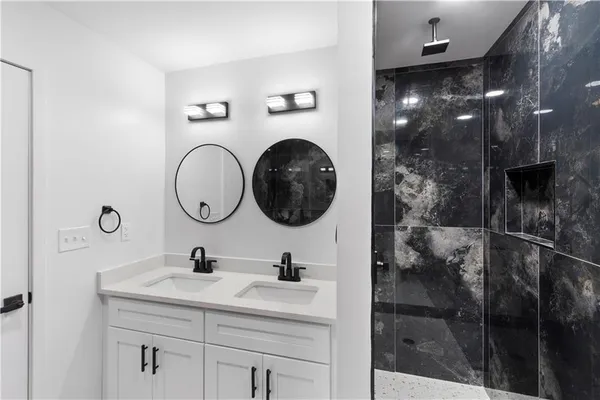 a bathroom with a sink a toilet and a bathtub