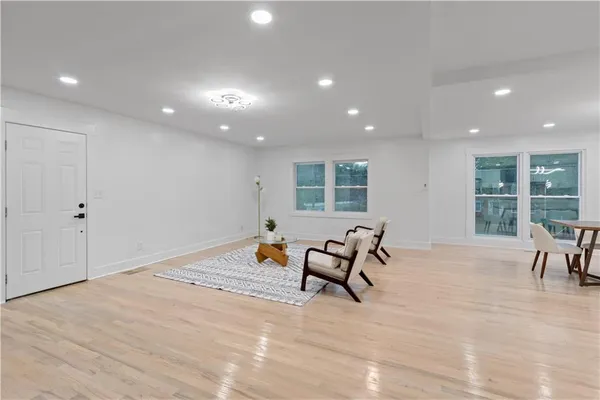 a dining room with furniture and window