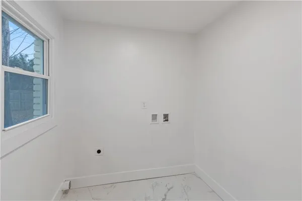 a kitchen with kitchen island a sink dining table and chairs