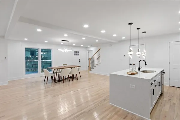 a living room with furniture and a fireplace with wooden floor