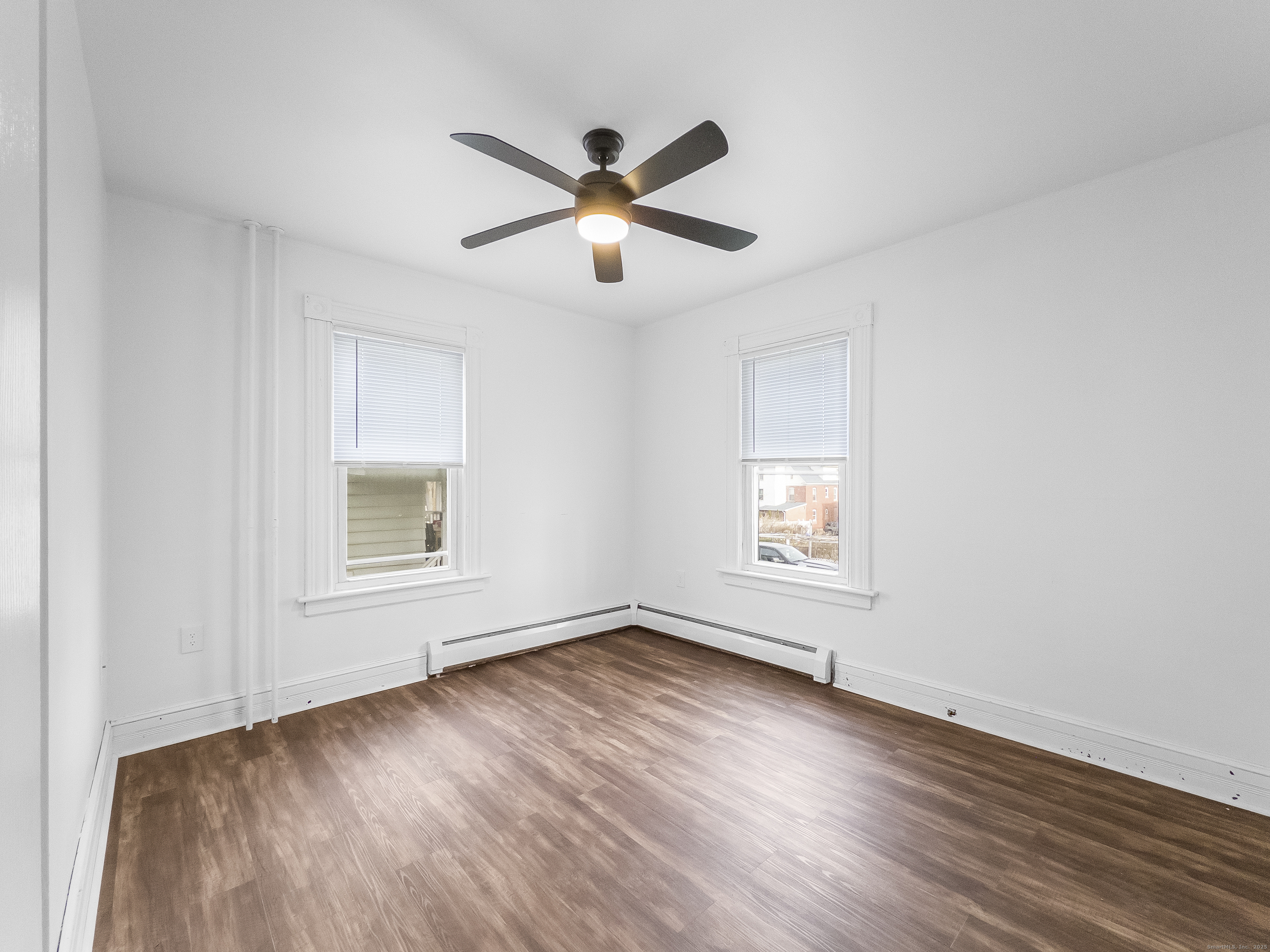 634 High Street, Unit 1 Middletown, CT 06457 - Photo 11 of 16 a view of empty room with wooden floor and fan