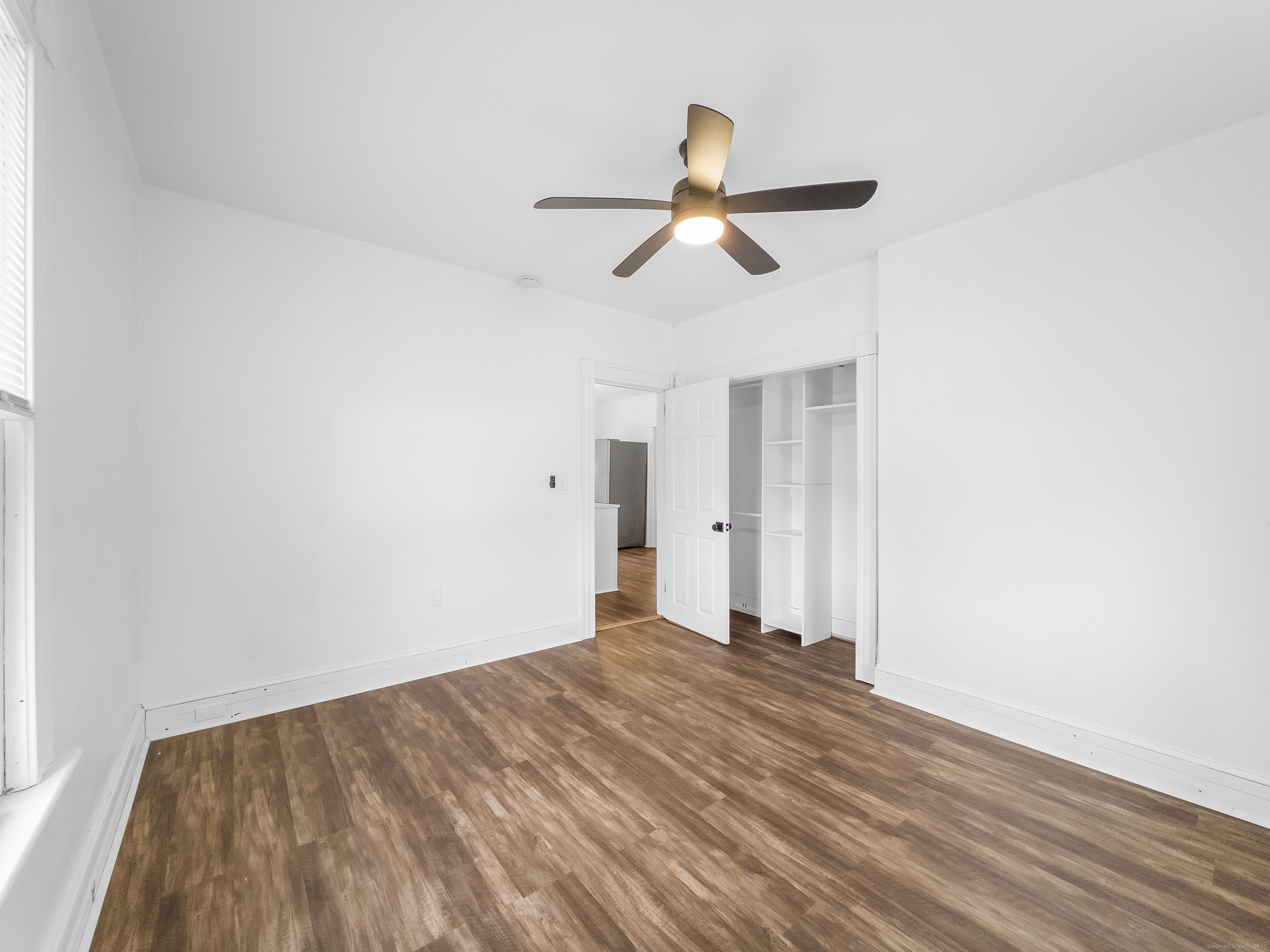 634 High Street, Unit 1 Middletown, CT 06457 - Photo 12 of 16 a view of room with wooden floor and ceiling fan