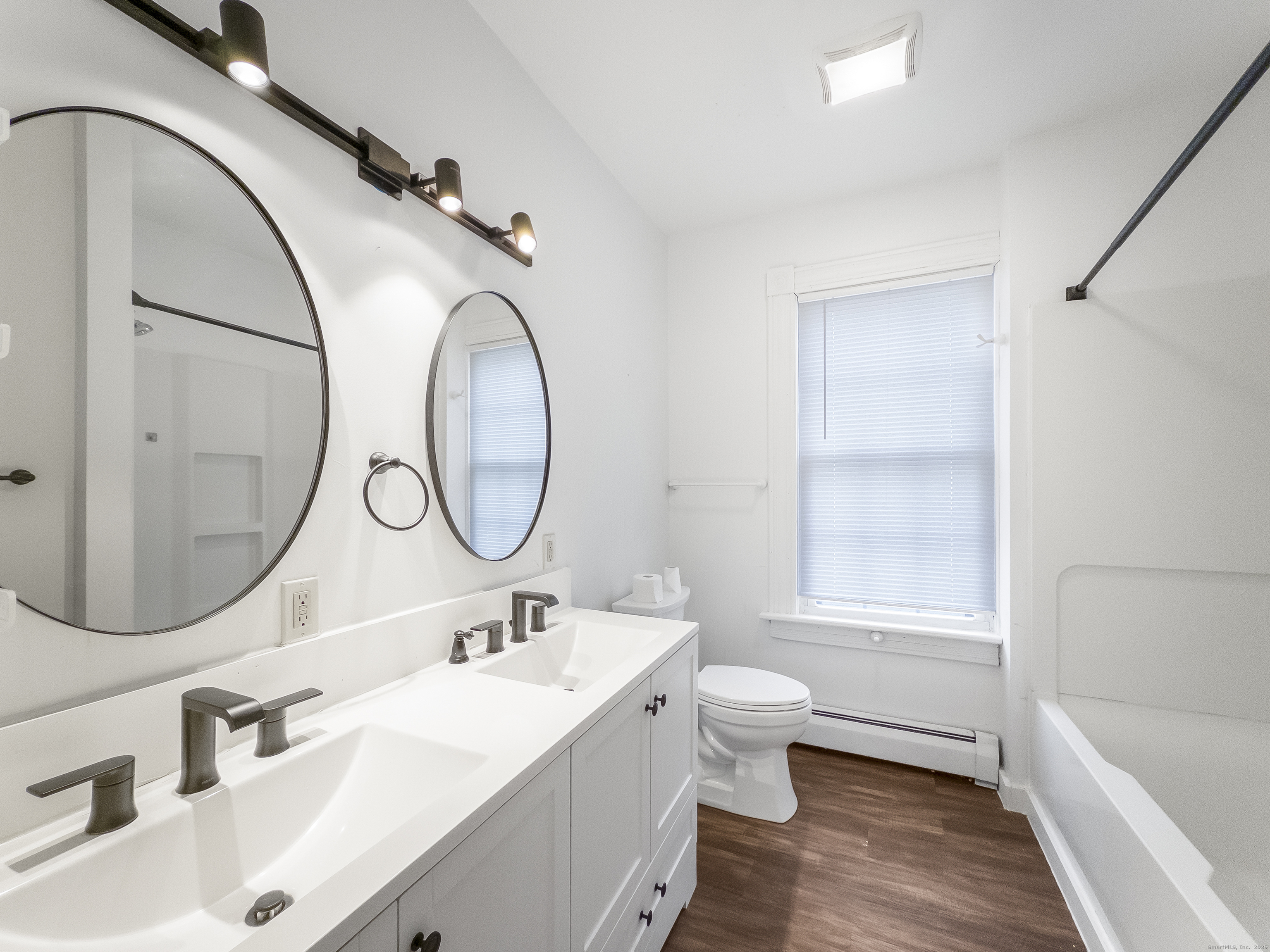 634 High Street, Unit 1 Middletown, CT 06457 - Photo 13 of 16 a bathroom with a sink and a mirror