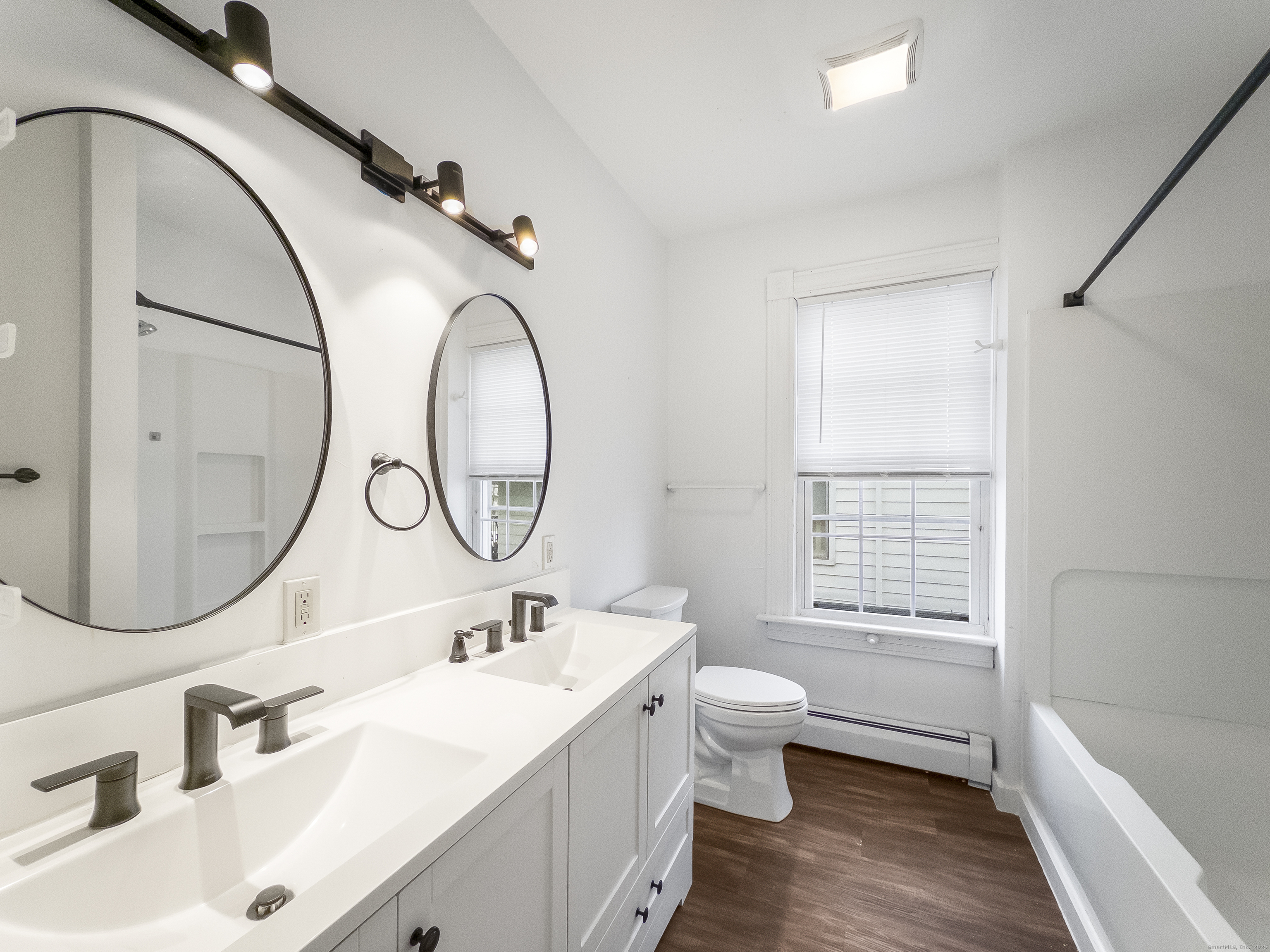 634 High Street, Unit 1 Middletown, CT 06457 - Photo 14 of 16 a bathroom with a sink and a mirror