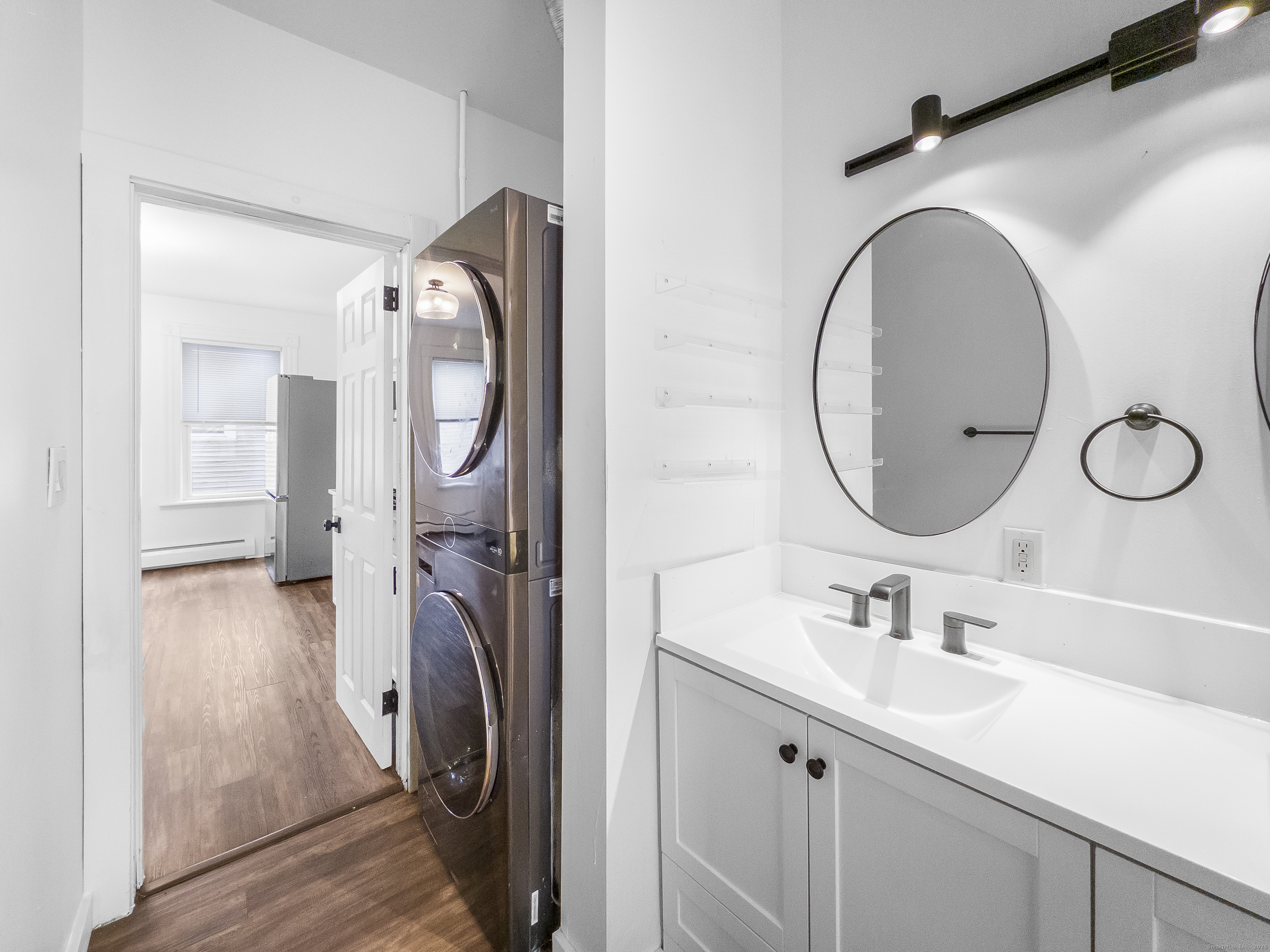 634 High Street, Unit 1 Middletown, CT 06457 - Photo 15 of 16 a bathroom with a sink and a mirror