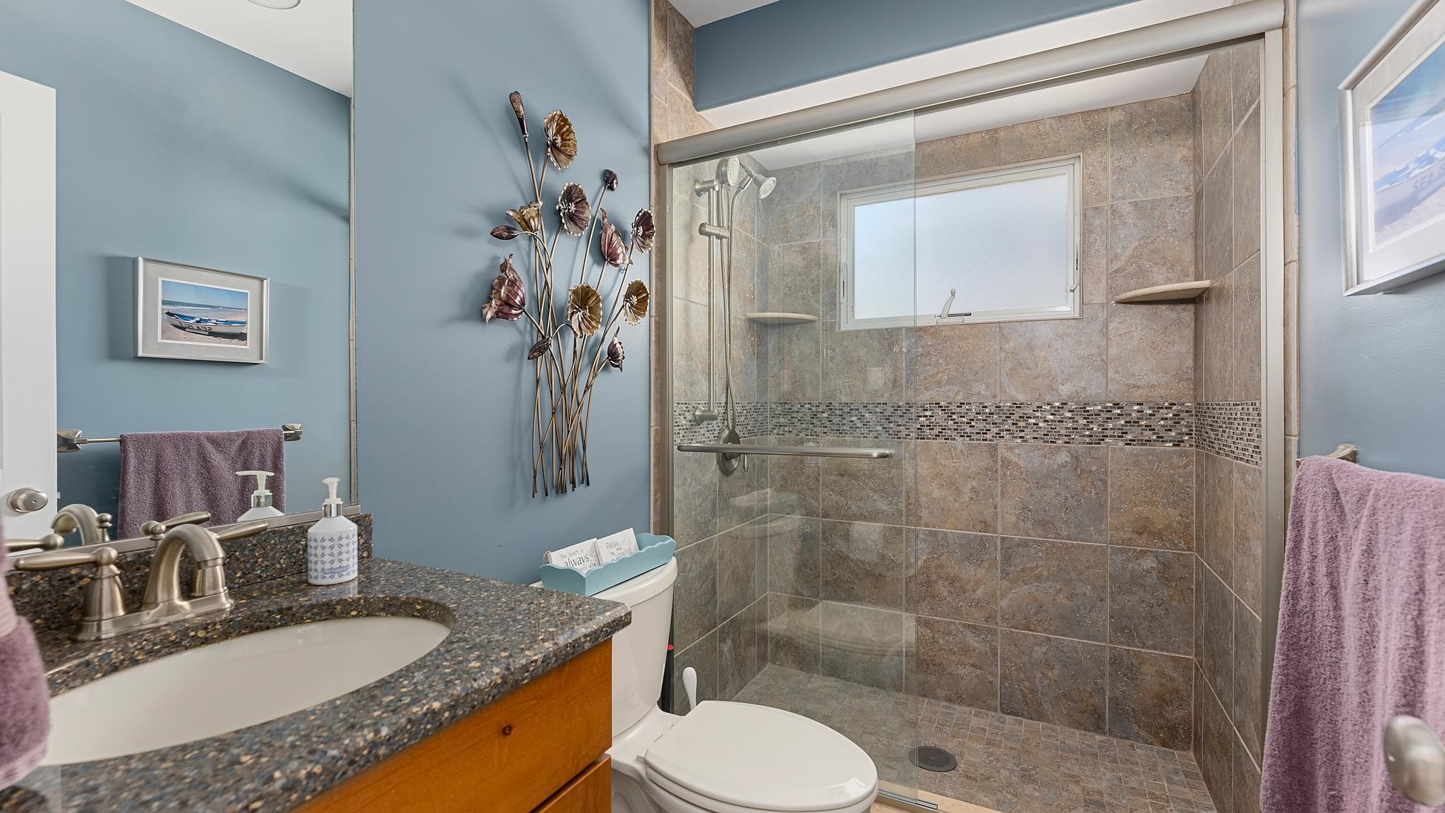 22 80th Street, Unit WEST Sea Isle City, NJ 08243 - Photo 14 of 32 a bathroom with a granite countertop sink toilet a mirror and shower