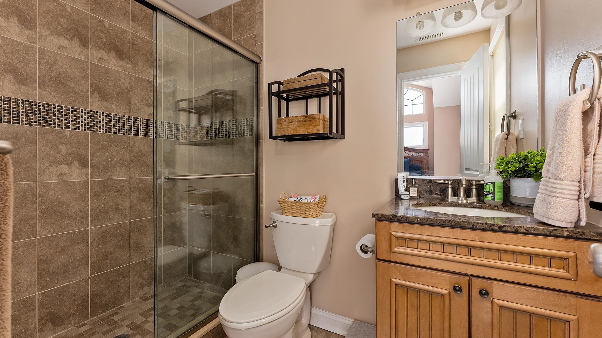 22 80th Street, Unit WEST Sea Isle City, NJ 08243 - Photo 18 of 32 a bathroom with a toilet a sink and shower