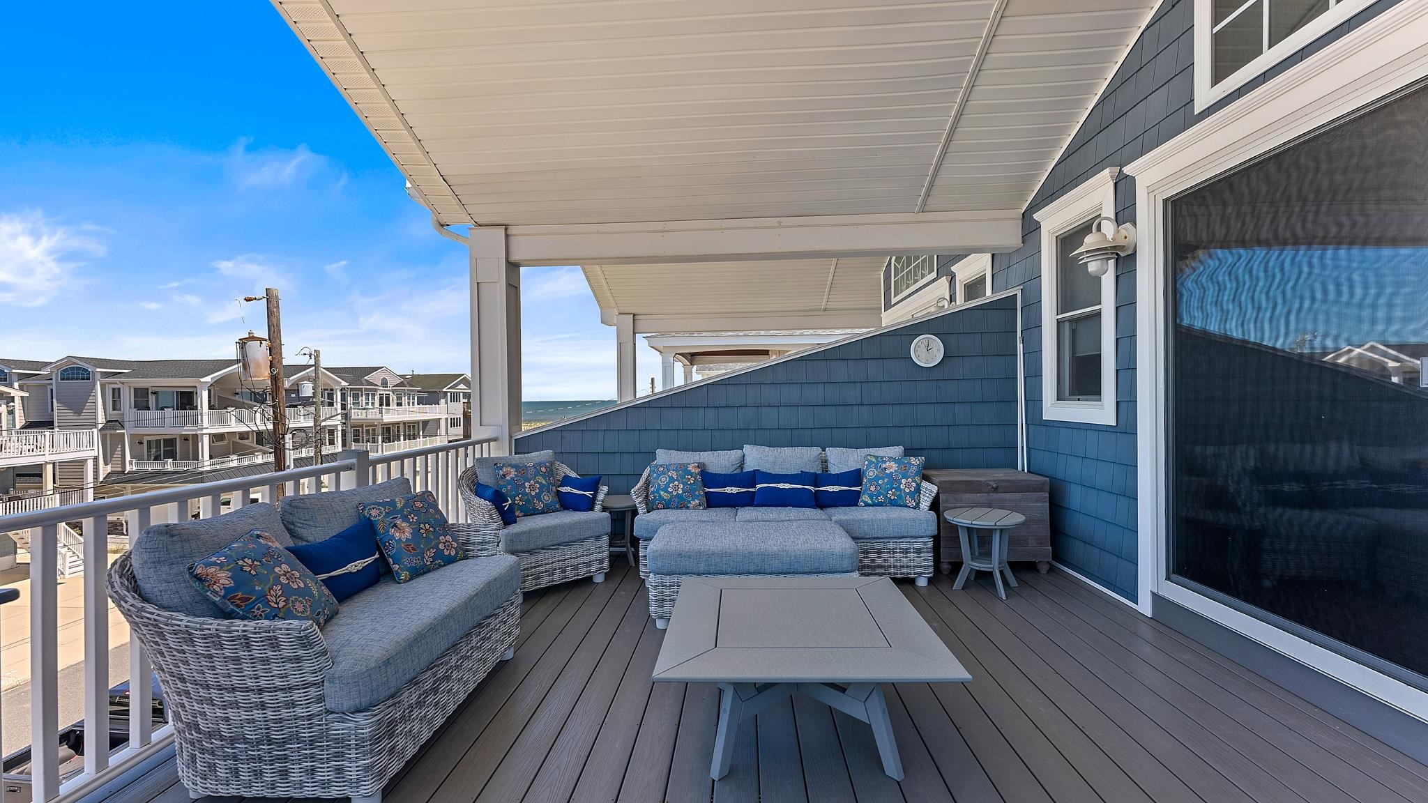 22 80th Street, Unit WEST Sea Isle City, NJ 08243 - Photo 3 of 32 a balcony with wooden floor and furniture