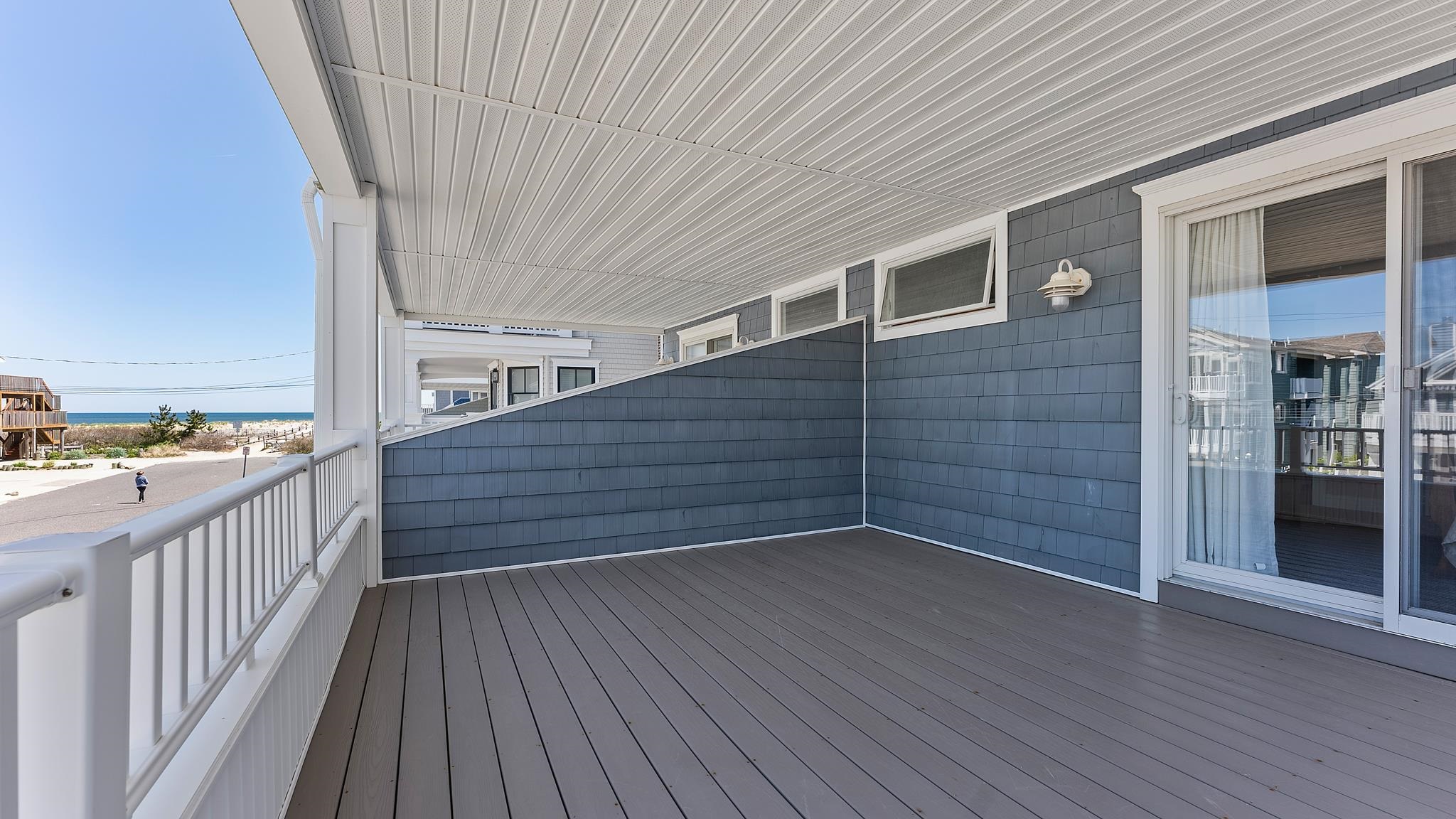 22 80th Street, Unit WEST Sea Isle City, NJ 08243 - Photo 21 of 32 a view of a balcony with wooden floor