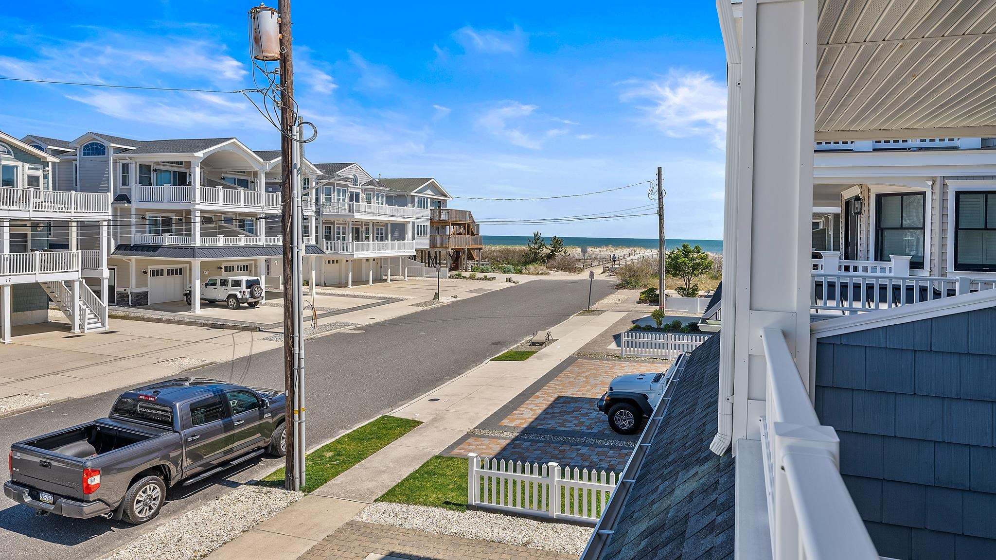 22 80th Street, Unit WEST Sea Isle City, NJ 08243 - Photo 22 of 32 a view of a balcony with city view