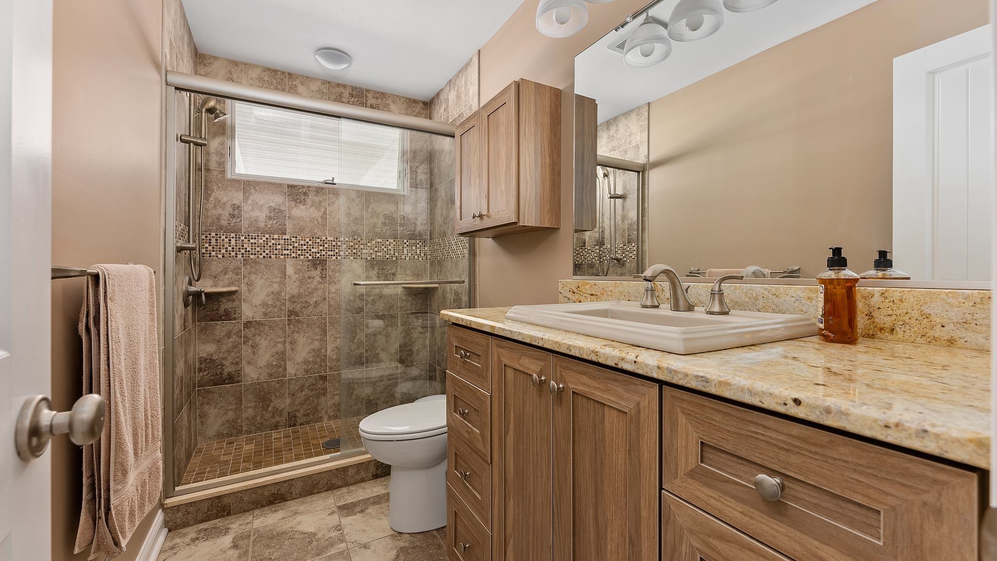 22 80th Street, Unit WEST Sea Isle City, NJ 08243 - Photo 23 of 32 a bathroom with a granite countertop sink toilet and shower