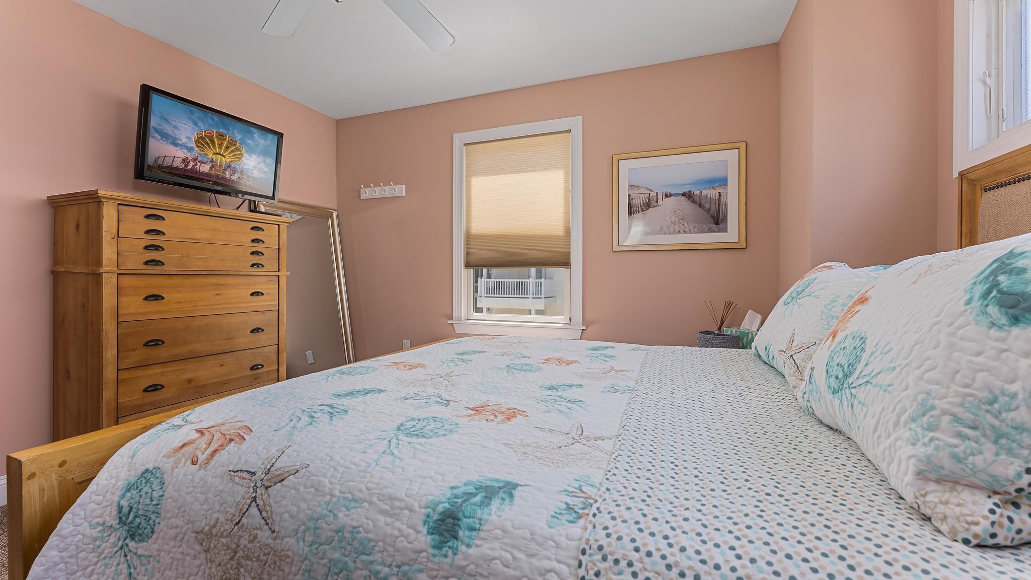 22 80th Street, Unit WEST Sea Isle City, NJ 08243 - Photo 25 of 32 a bedroom with a bed and a flat screen tv