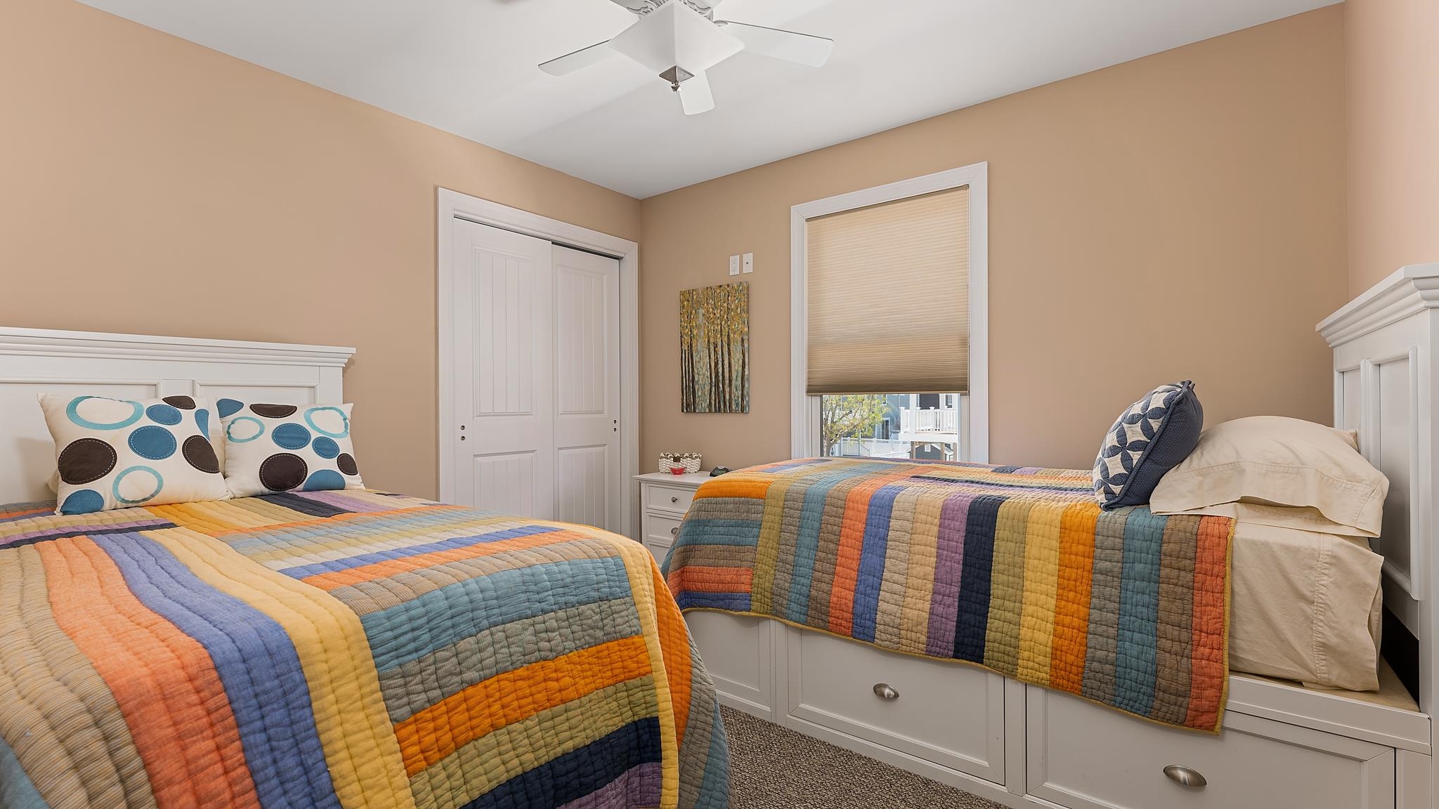 22 80th Street, Unit WEST Sea Isle City, NJ 08243 - Photo 26 of 32 a bedroom with two beds and a chandelier