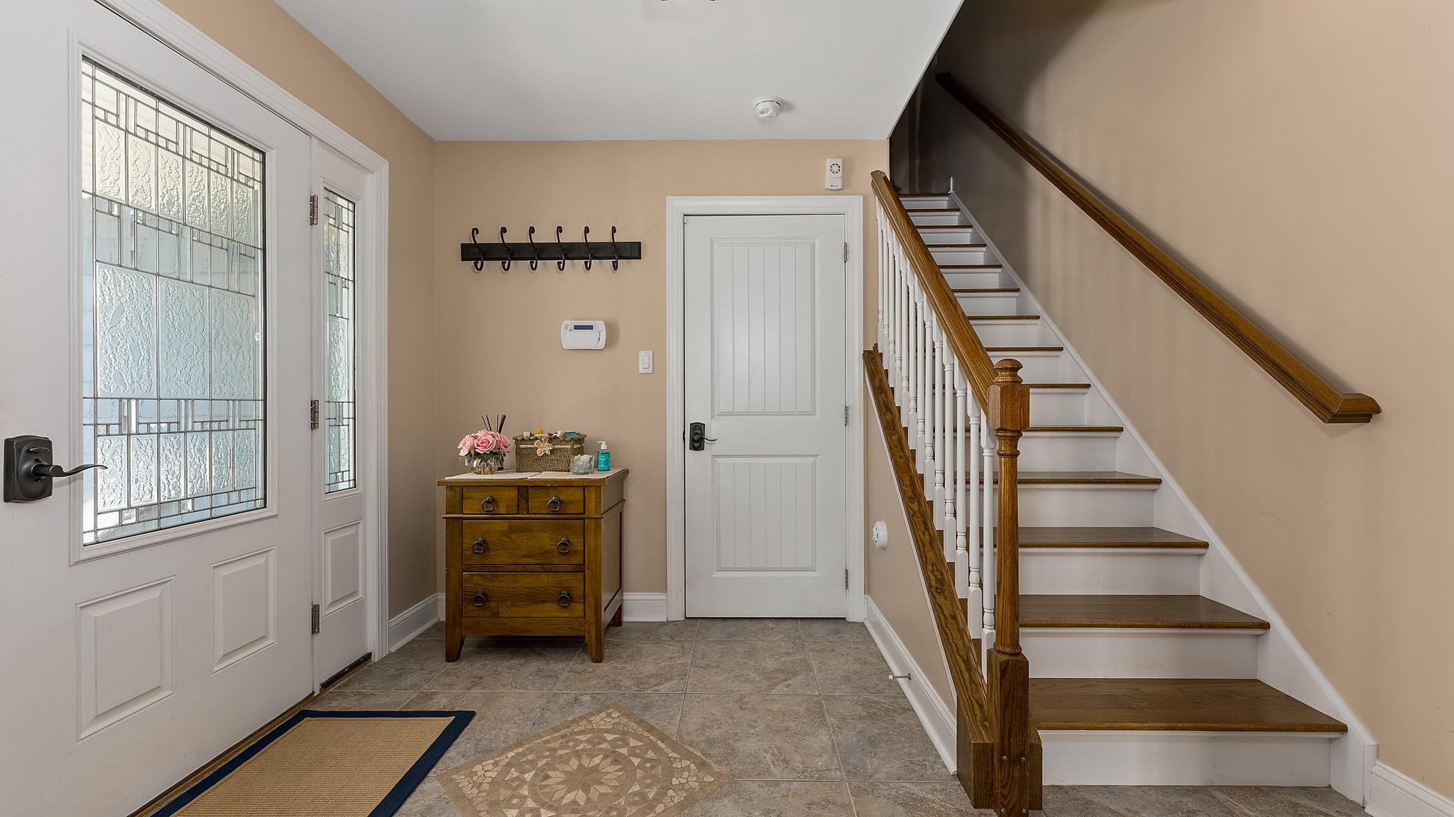 22 80th Street, Unit WEST Sea Isle City, NJ 08243 - Photo 29 of 32 a view of a hallway with windows and stairs