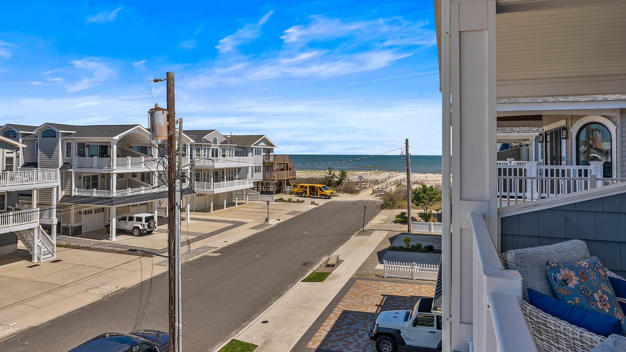 22 80th Street, Unit WEST Sea Isle City, NJ 08243 - Photo 4 of 32 a view of a balcony with yard