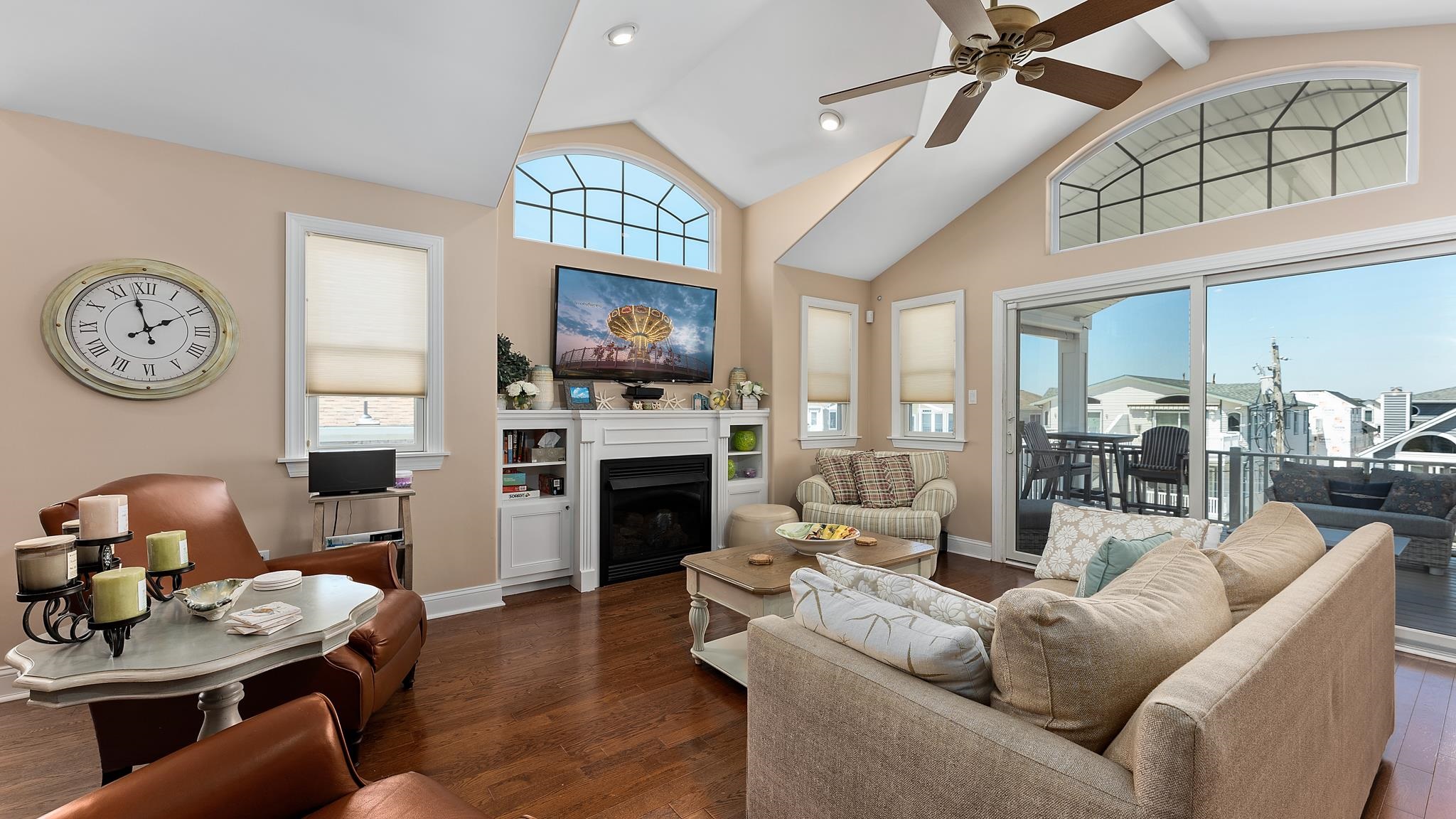 22 80th Street, Unit WEST Sea Isle City, NJ 08243 - Photo 5 of 32 a living room with furniture a fireplace and a flat screen tv