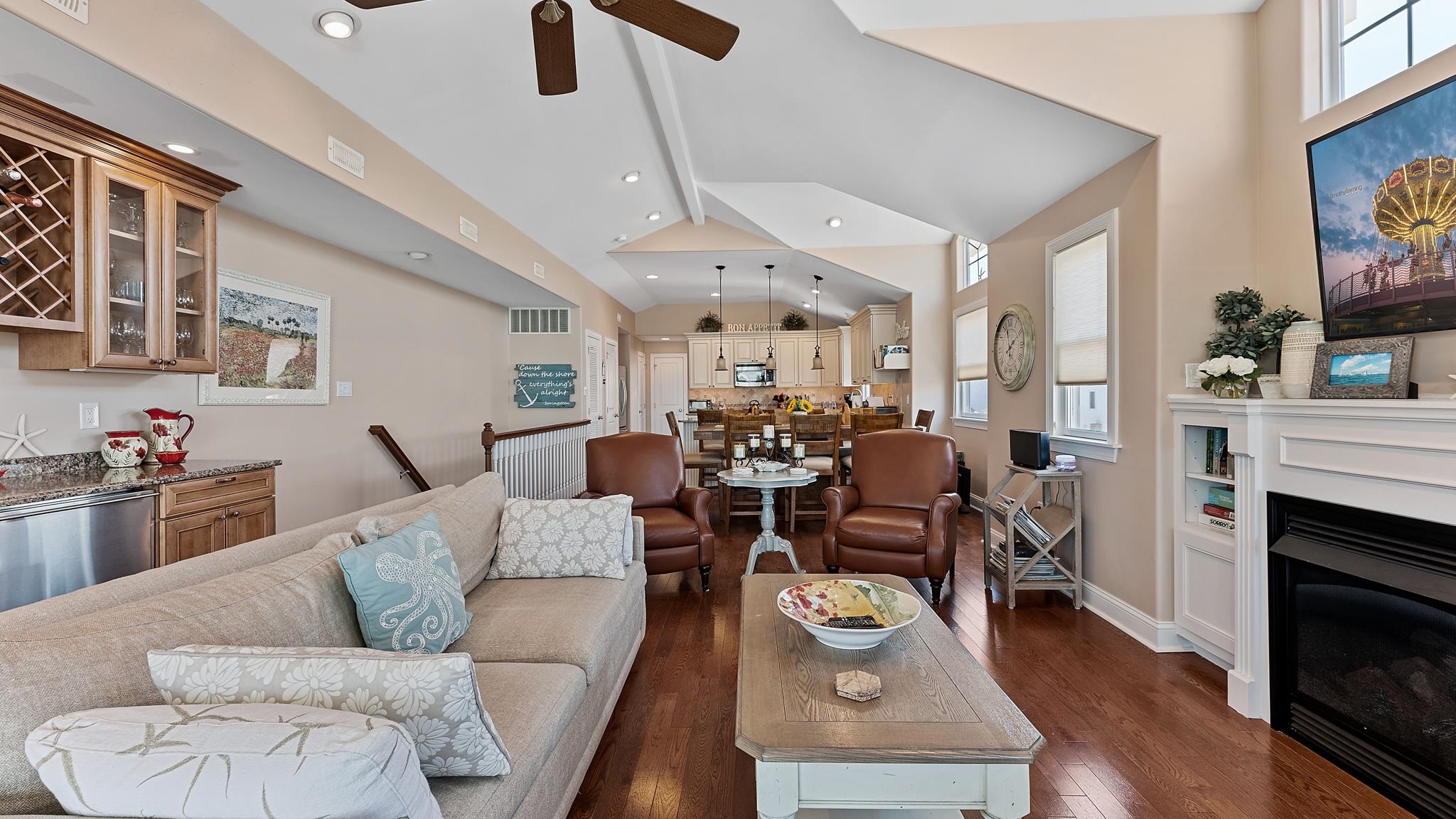 22 80th Street, Unit WEST Sea Isle City, NJ 08243 - Photo 6 of 32 a living room with furniture kitchen view and a fireplace