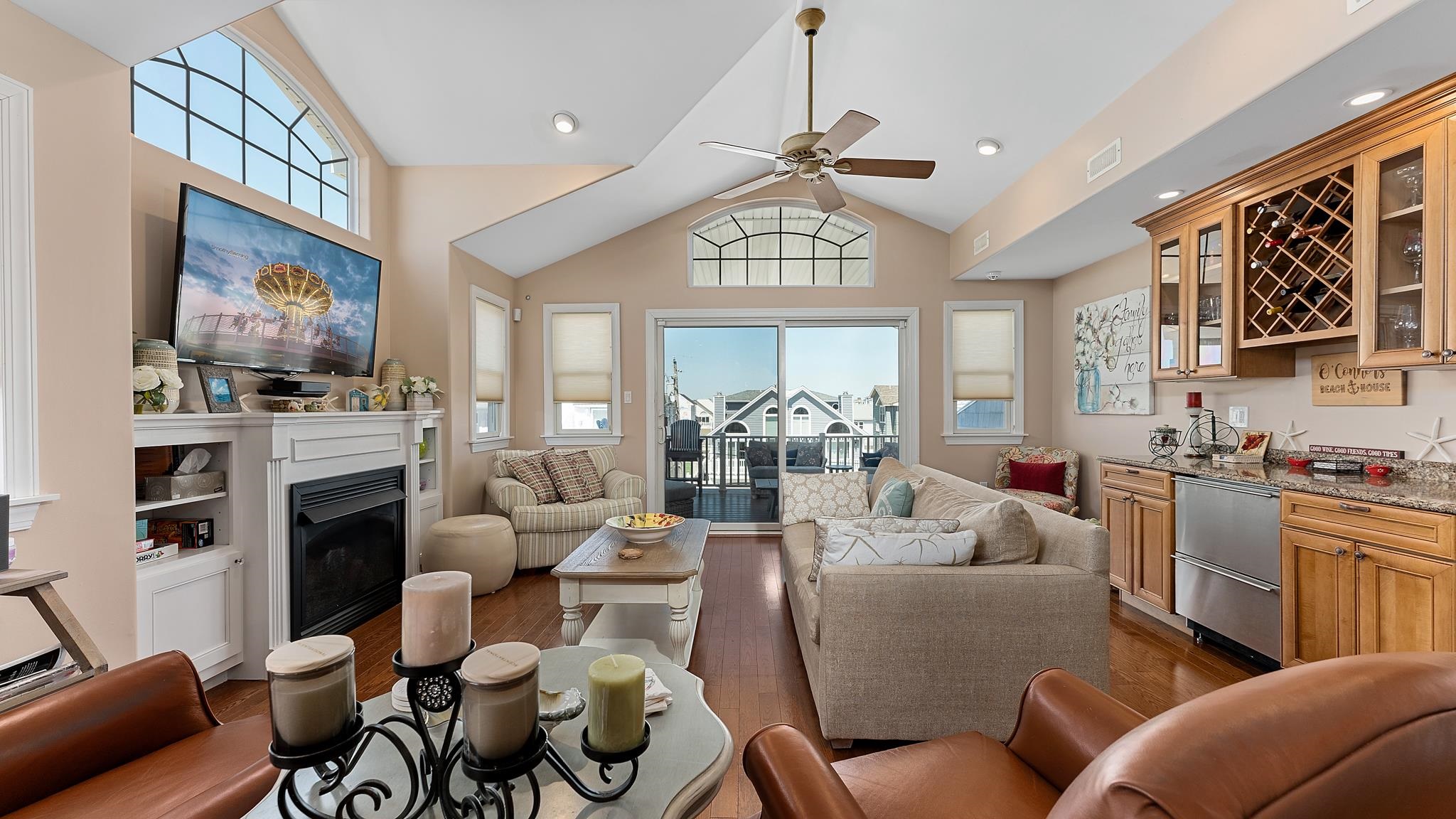 22 80th Street, Unit WEST Sea Isle City, NJ 08243 - Photo 7 of 32 a living room with furniture flat screen tv and a fireplace
