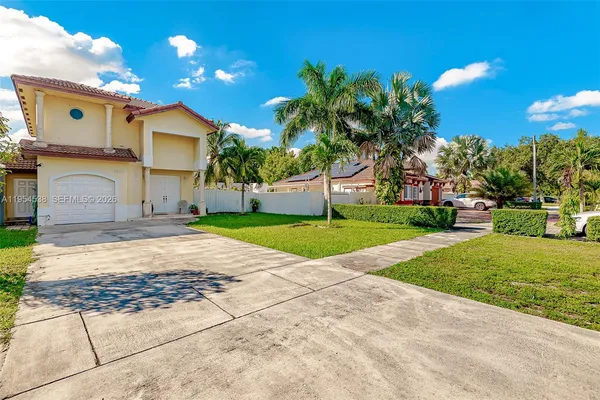 a view of a patio with a yard