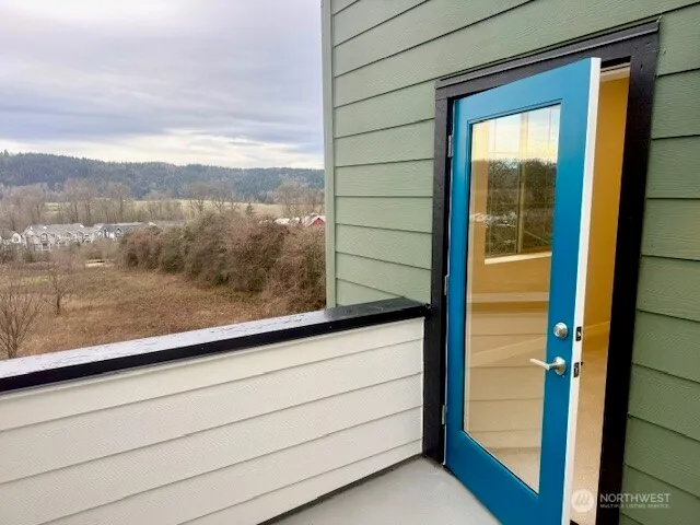 a view of a chairs and table in backyard