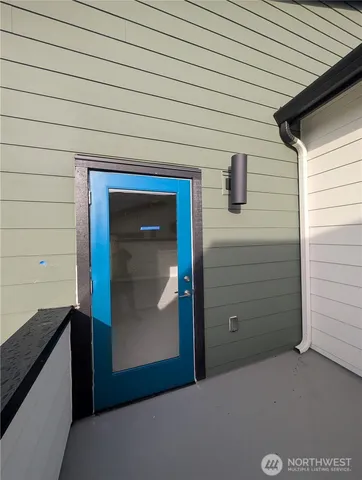 a view of a patio with a table chairs and backyard