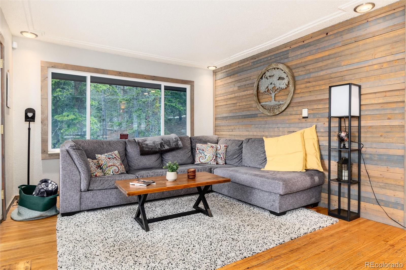 159 Lake Road Idaho Springs, CO 80452 - Photo 9 of 45 a living room with furniture and a large window
