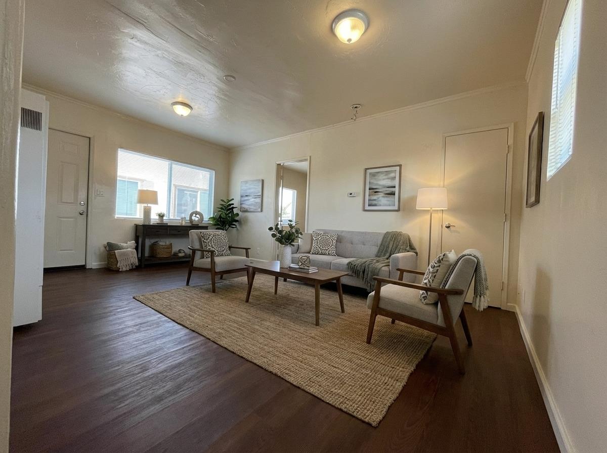 236 Locust Street Watsonville, CA 95076 - Photo 5 of 9 a living room with furniture and a wooden floor