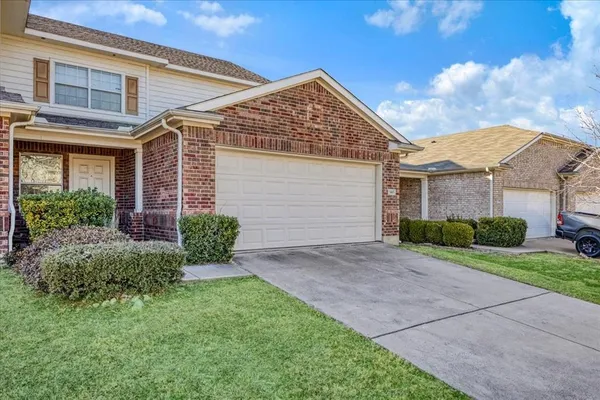 front view of a house and a yard