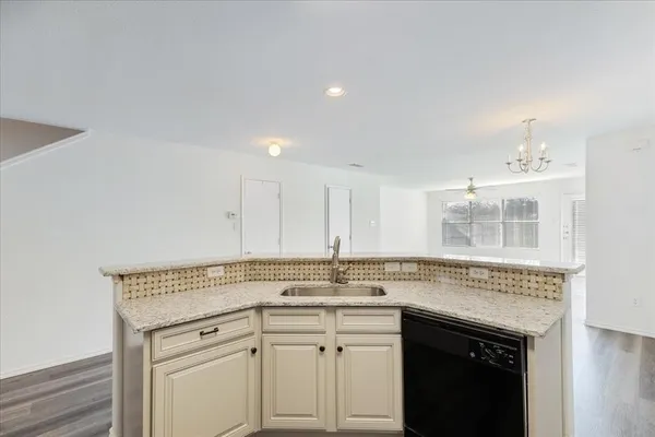 a kitchen with cabinets appliances and a counter top
