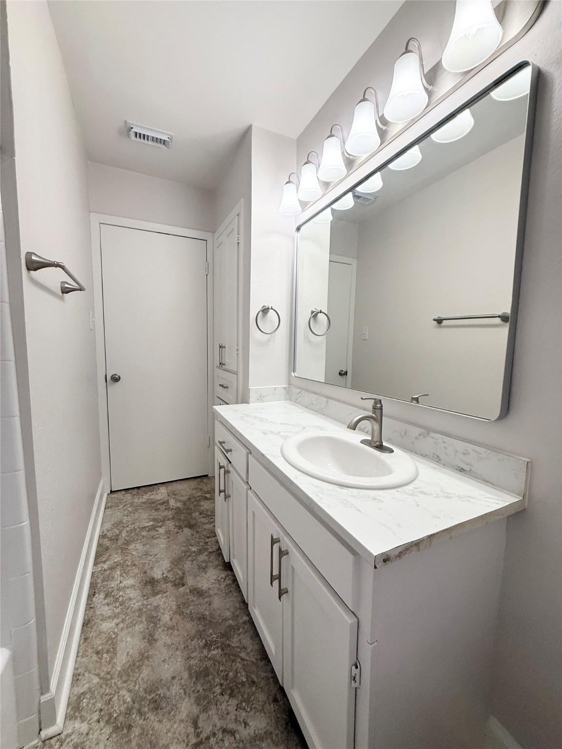 913 Wimberly Street Angleton, TX 77515 - Photo 18 of 24 a bathroom with a sink a mirror and a shower