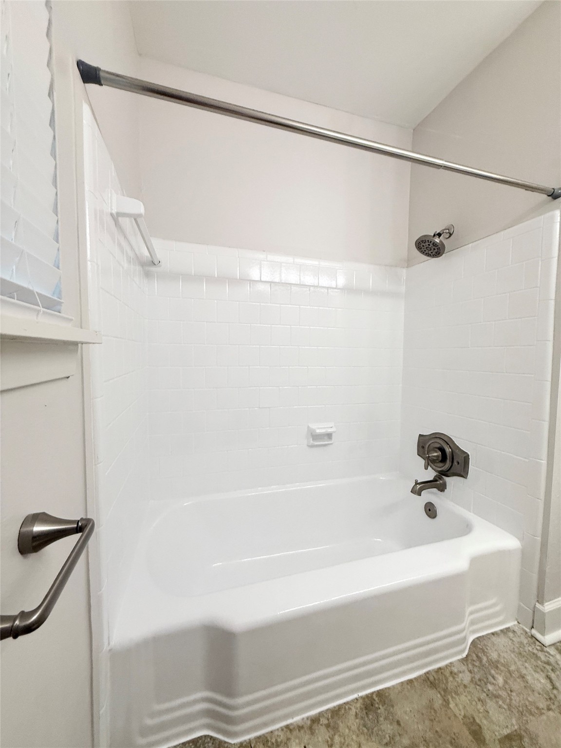 913 Wimberly Street Angleton, TX 77515 - Photo 19 of 24 a bathroom with a shower and a bath tub