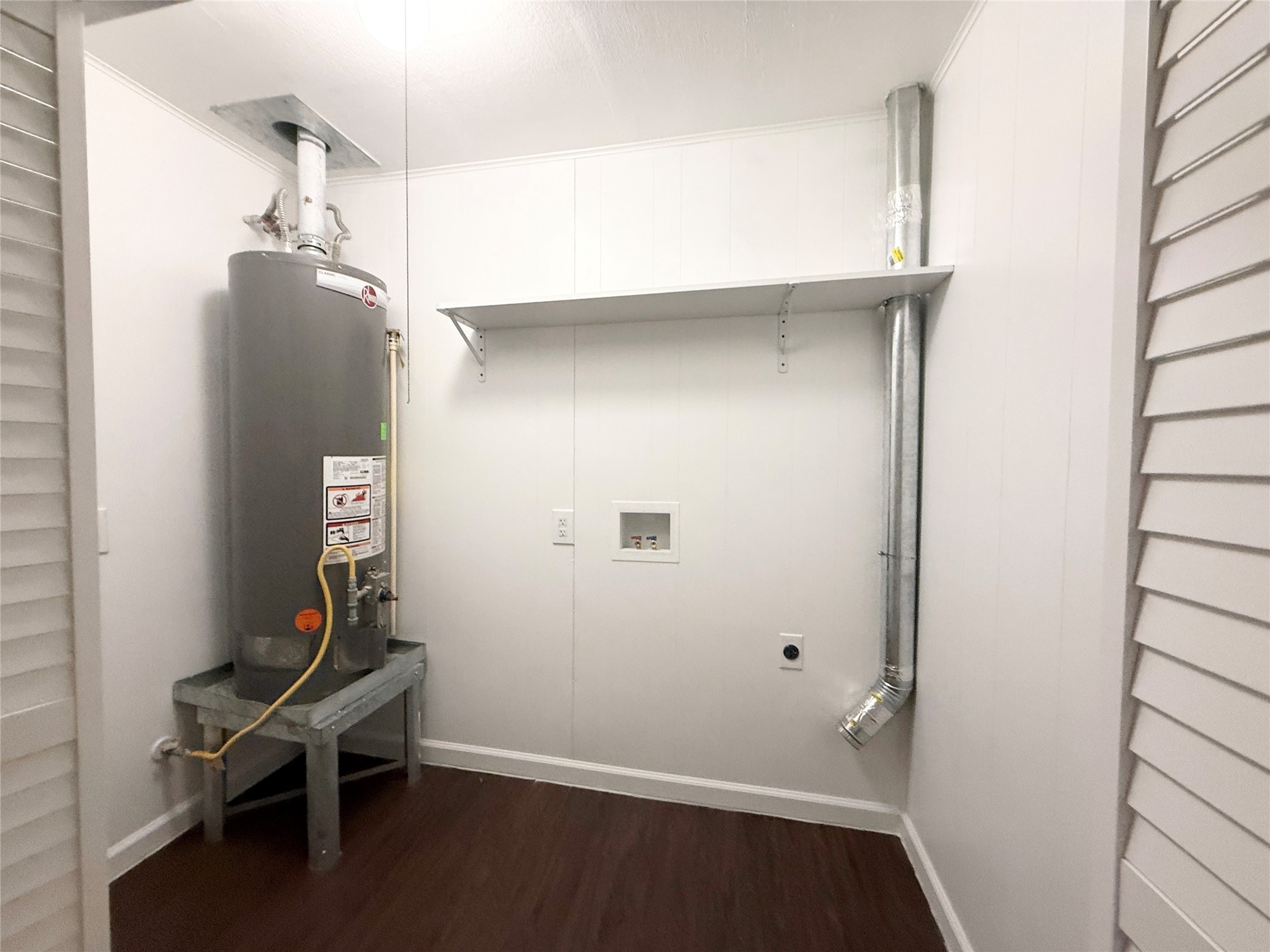 913 Wimberly Street Angleton, TX 77515 - Photo 22 of 24 a room with a walk in closet and wooden floor