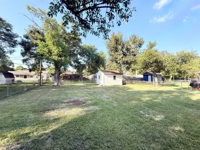 a view of a park with large trees