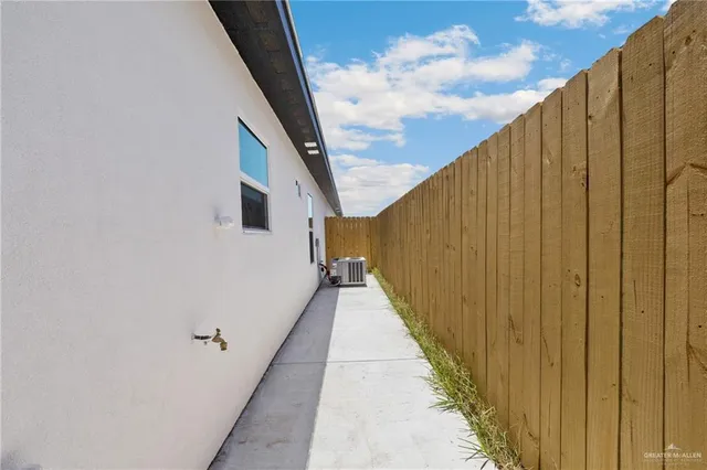 a view of a balcony with wooden fence