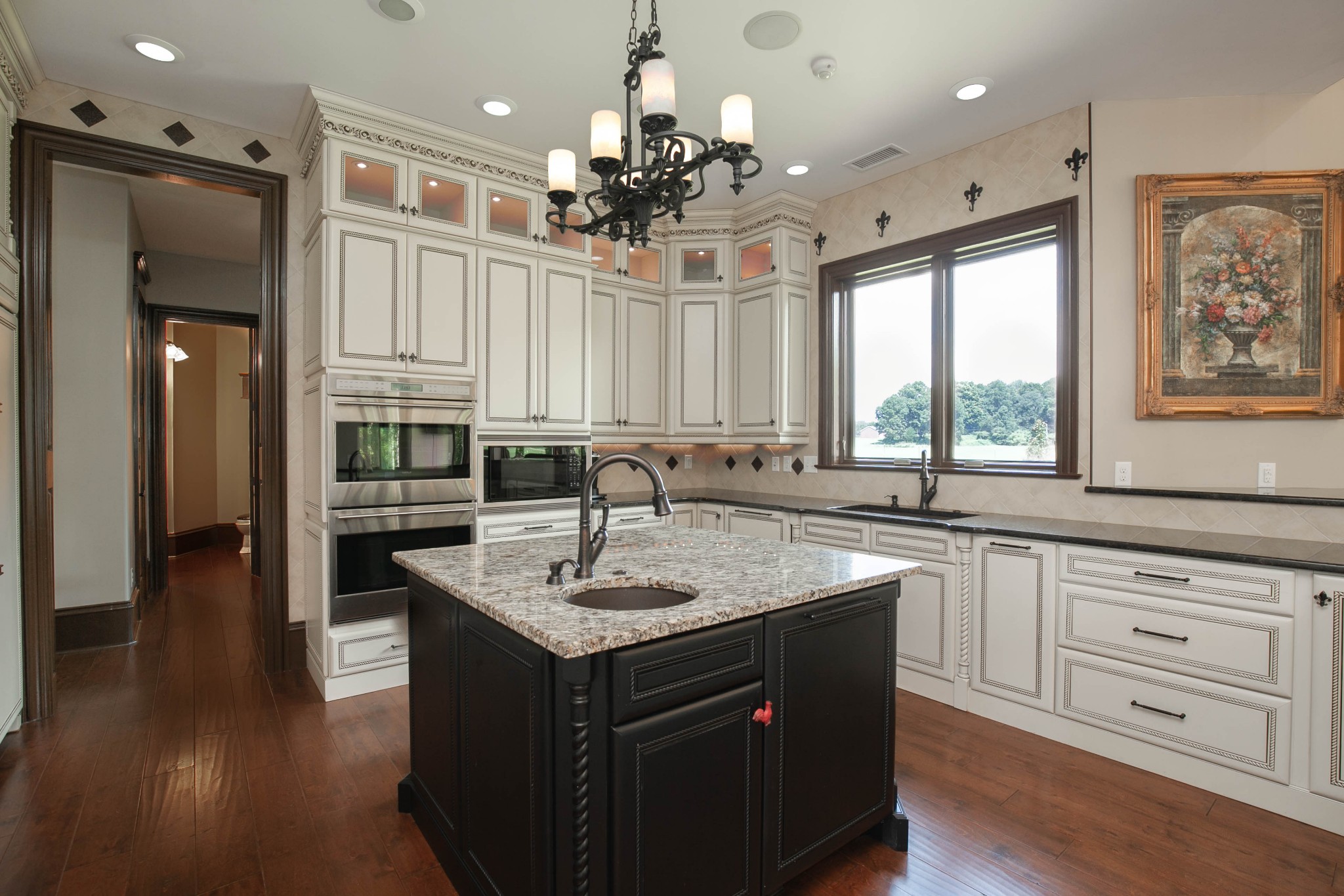 3747 Armstrong Road Springfield, TN 37172 - Photo 16 of 50 a kitchen with kitchen island granite countertop a sink cabinets and wooden floor