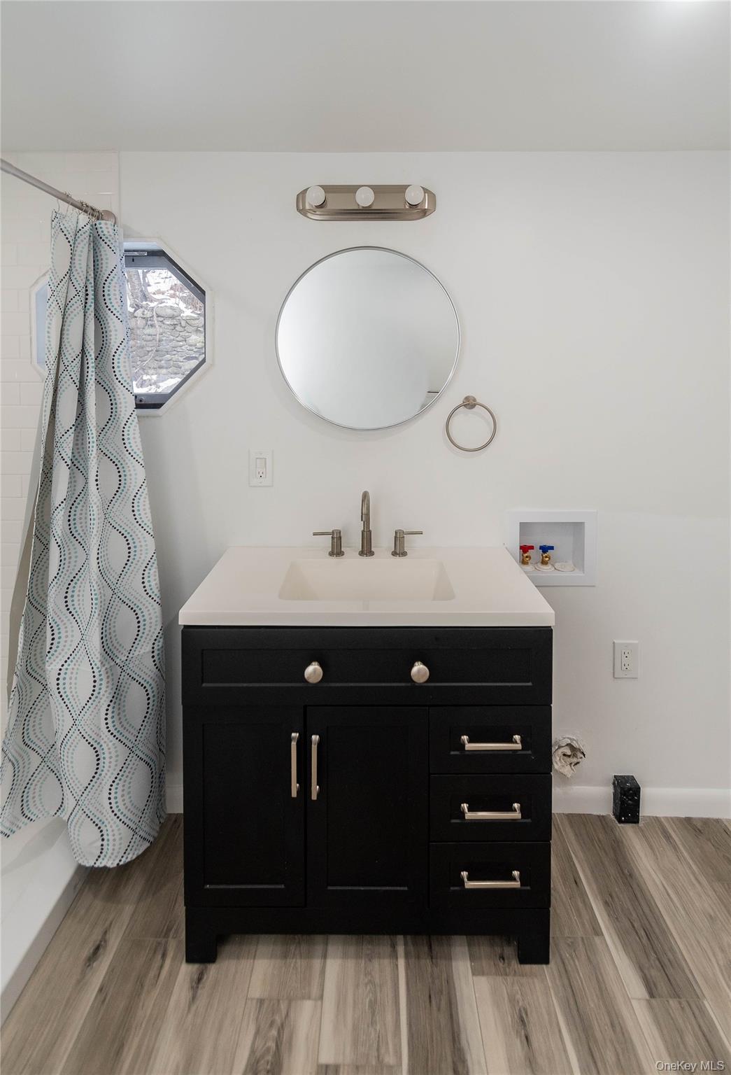 112 State Rte 55 Napanoch, NY 12458 - Photo 15 of 42 a bathroom with a sink vanity and mirror