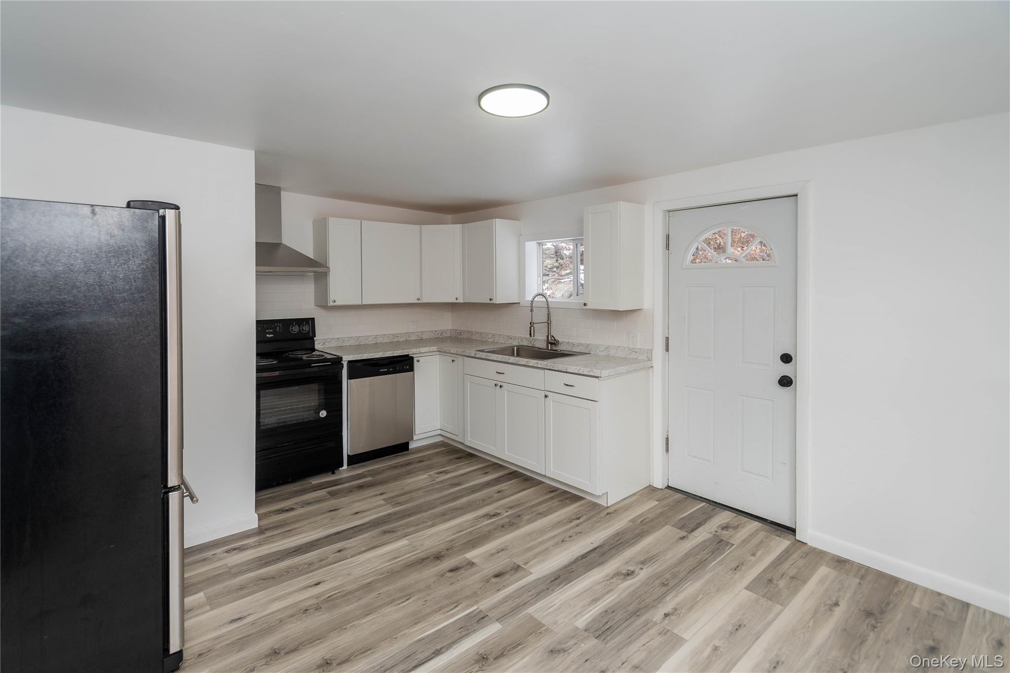 112 State Rte 55 Napanoch, NY 12458 - Photo 18 of 42 a kitchen with a refrigerator sink and cabinets
