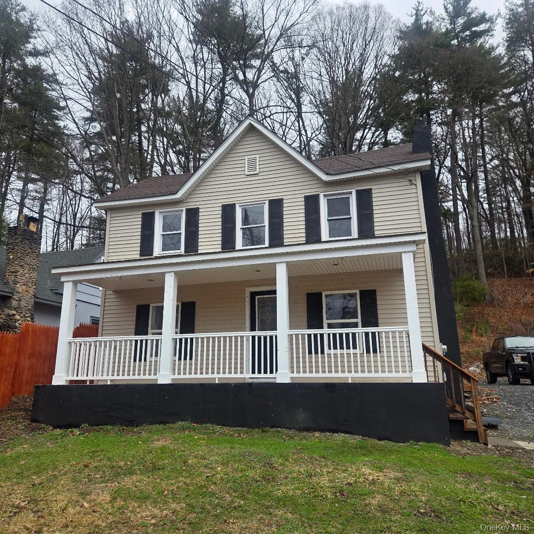 112 State Rte 55 Napanoch, NY 12458 - Photo 2 of 42 a front view of a house with a yard