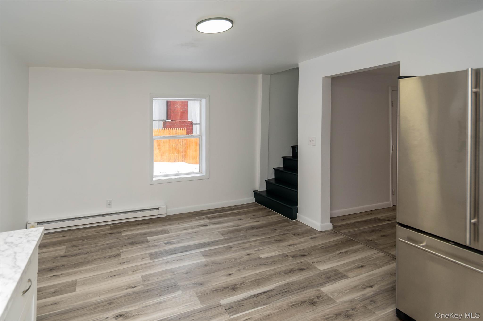 112 State Rte 55 Napanoch, NY 12458 - Photo 21 of 42 a view of an empty room with wooden floor and a window