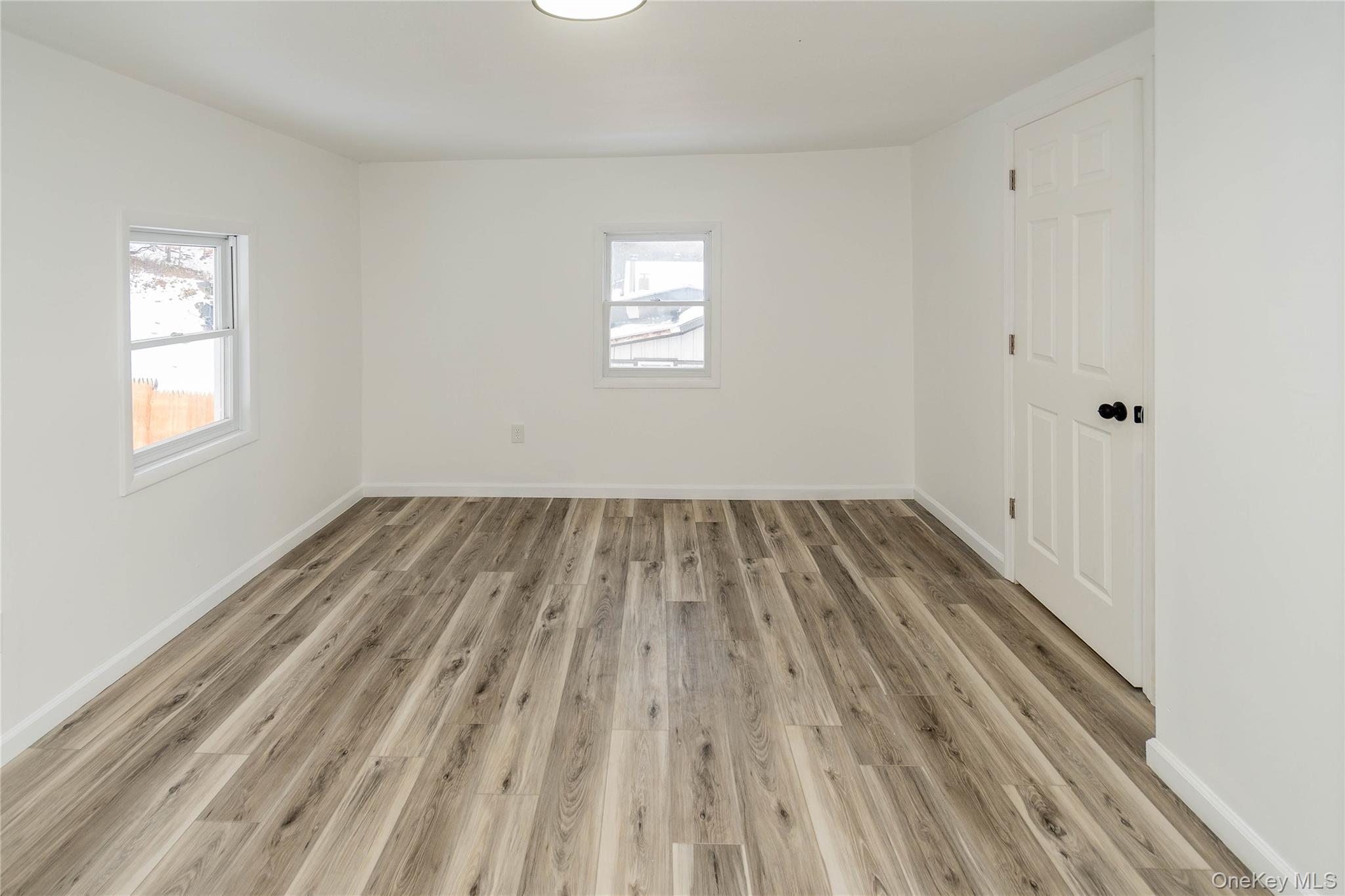 112 State Rte 55 Napanoch, NY 12458 - Photo 28 of 42 a view of a room with wooden floor and white walls