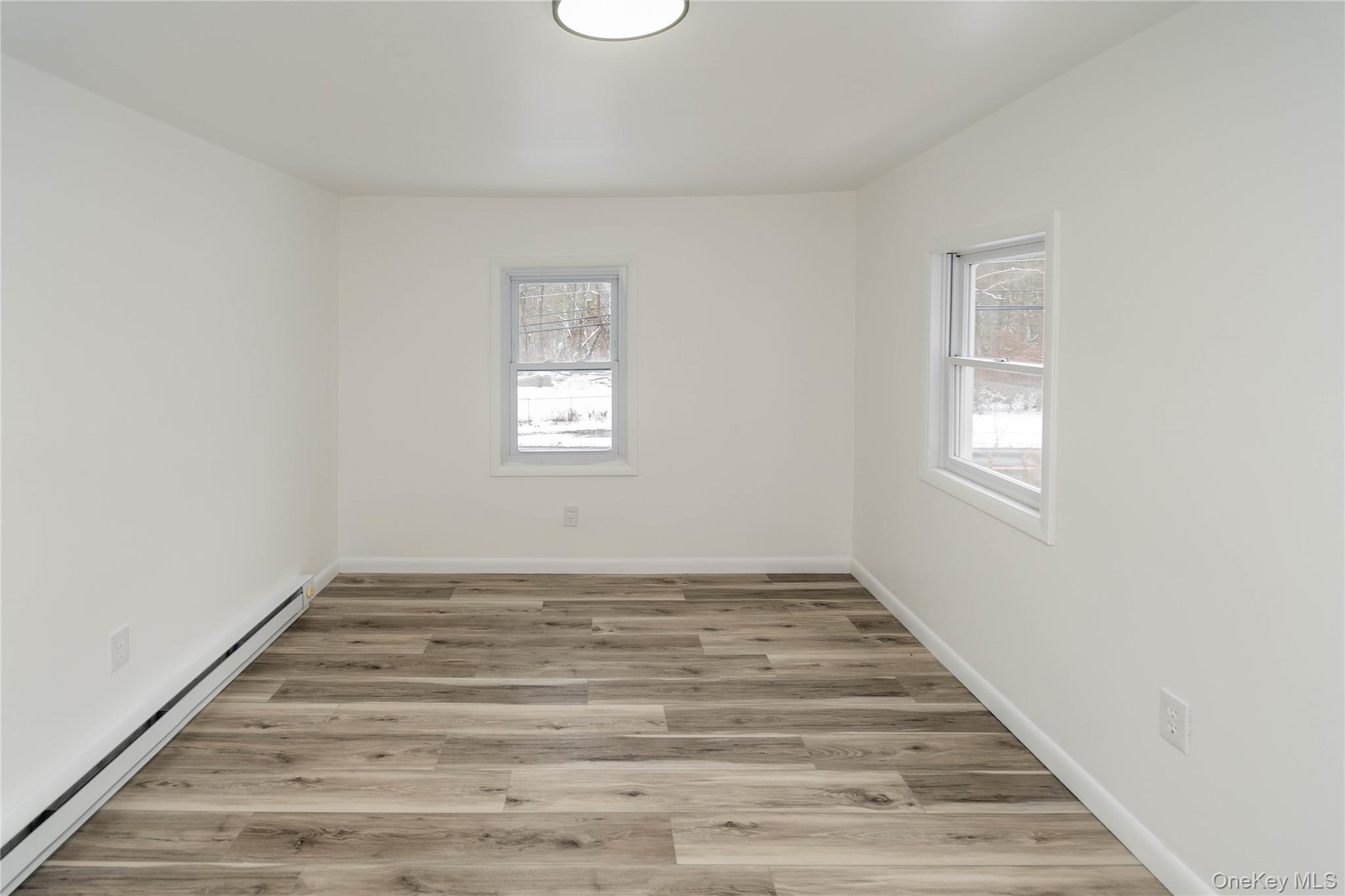 112 State Rte 55 Napanoch, NY 12458 - Photo 30 of 42 a view of an empty room with wooden floor and a window