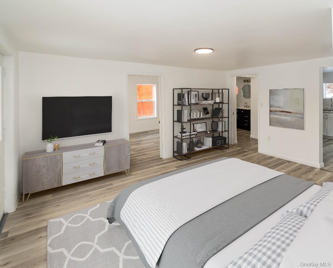 112 State Rte 55 Napanoch, NY 12458 - Photo 6 of 42 a bedroom with a bed and a flat screen tv